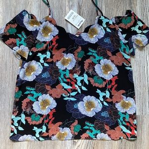 Cute strap and shoulder cuff tank!